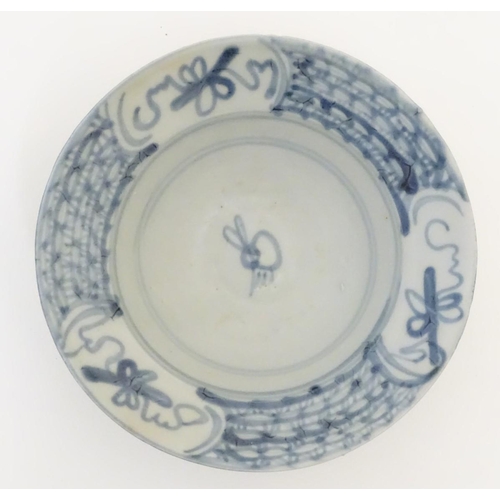 60 - An 18thC Chinese blue and white bowl, with hand painted decoration, the border decorated with scroll... 