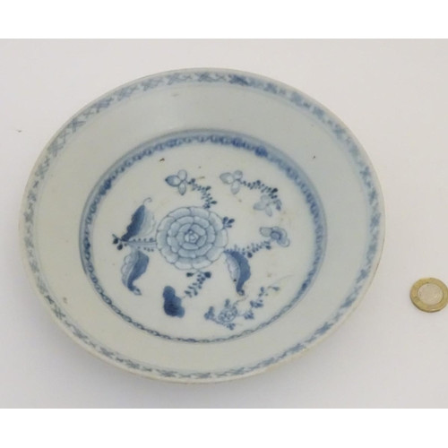 62 - An 18thC Chinese blue and white plate, with hand painted floral decoration. Bears 'Nagel Auctions Te... 