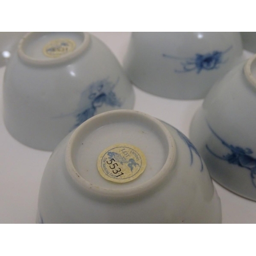 63 - A set of six 18thC Chinese Nanking Cargo blue and white tea bowls and saucers, decorated with pine t... 