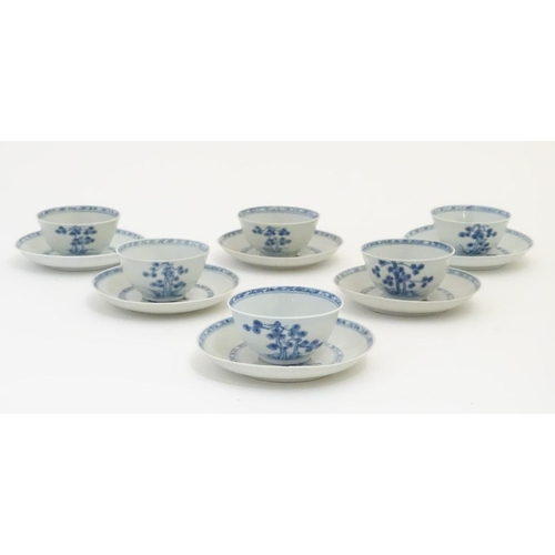 63 - A set of six 18thC Chinese Nanking Cargo blue and white tea bowls and saucers, decorated with pine t... 