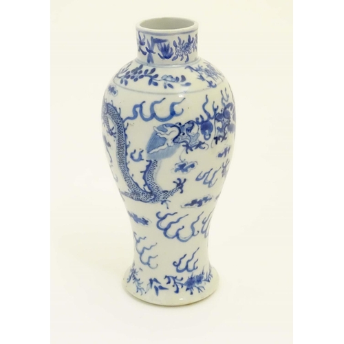 7 - A Chinese blue and white vase with stylised dragon and cloud decoration and floral borders. Characte... 