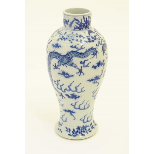 7 - A Chinese blue and white vase with stylised dragon and cloud decoration and floral borders. Characte... 