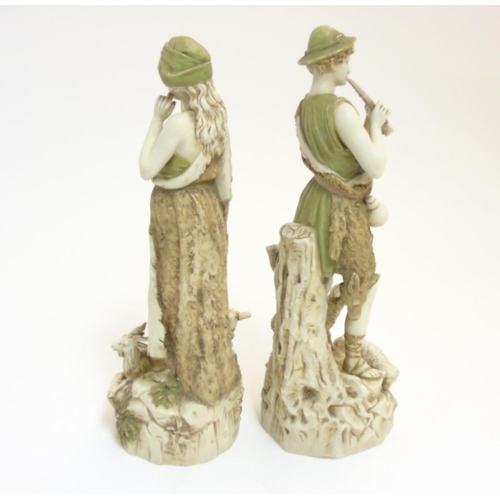 75 - A pair of early 20thC Royal Dux Bohemia figures comprising a shepherd playing the flute and a shephe... 