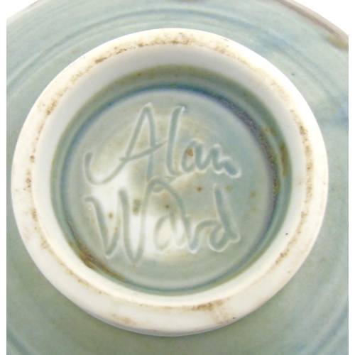 86 - Two 20thC Alan Ward studio pottery bowls, one decorated with blue and brown trail detail on a pale b... 