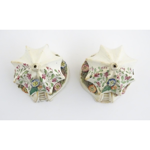 80 - A pair of Staffordshire pottery pastille burners in the form of cottages, decorated with flowers. Ap... 