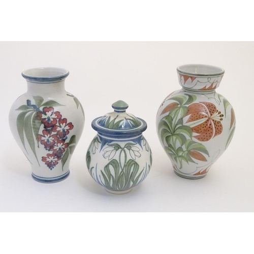 96 - Three items of Laurence McGowan British studio pottery, to include a vase with hand painted lily dec... 