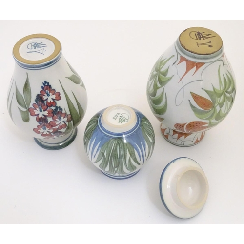 96 - Three items of Laurence McGowan British studio pottery, to include a vase with hand painted lily dec... 