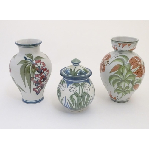 96 - Three items of Laurence McGowan British studio pottery, to include a vase with hand painted lily dec... 