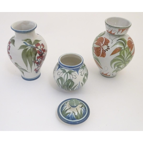 96 - Three items of Laurence McGowan British studio pottery, to include a vase with hand painted lily dec... 