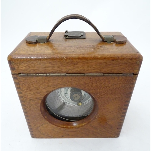 107 - Pigeon Racing : a Toulet Pigeon timing clock with mahogany case , brass fittings and leather carry s... 