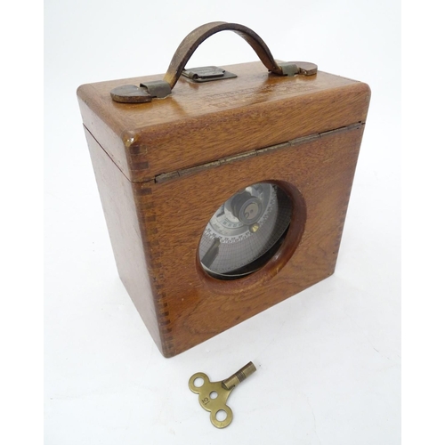 107 - Pigeon Racing : a Toulet Pigeon timing clock with mahogany case , brass fittings and leather carry s... 