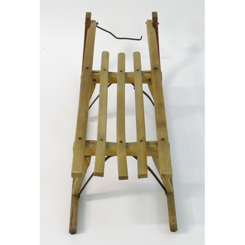 110 - A mid 20thC traditional sledge with high slatted wooden seat and metal runners etc., approximately 1... 