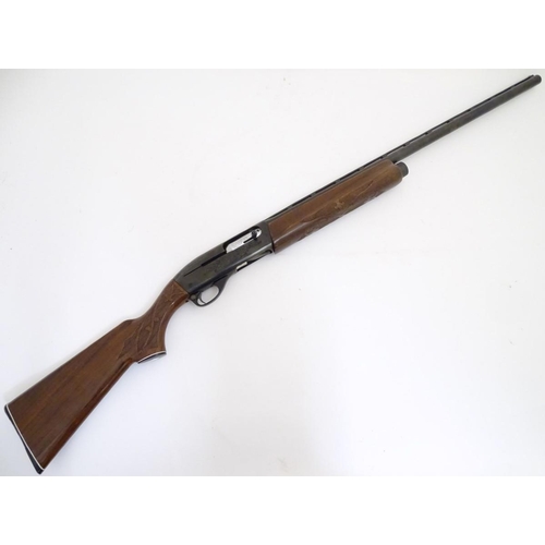 500 - Shotgun: a Remington 'Model 1100' 12 bore semi-automatic sporting gun. 28'' barrel with raised venti... 