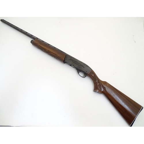 500 - Shotgun: a Remington 'Model 1100' 12 bore semi-automatic sporting gun. 28'' barrel with raised venti... 