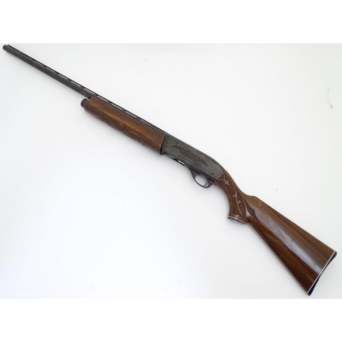 500 - Shotgun: a Remington 'Model 1100' 12 bore semi-automatic sporting gun. 28'' barrel with raised venti... 