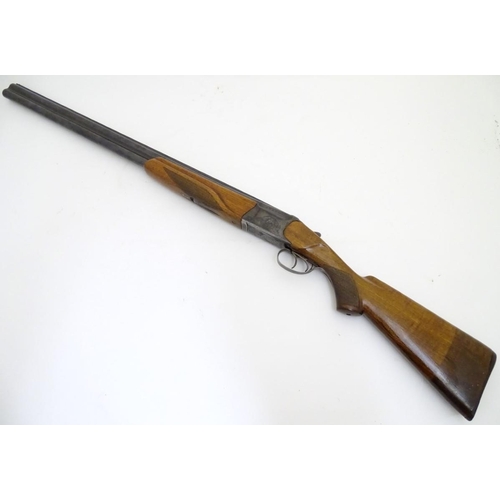 507 - Shotgun: a Baikal 'IJ-27' 12 bore over and under, 28 1/2'' barrels with solid, flat file cut top rib... 