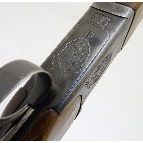 507 - Shotgun: a Baikal 'IJ-27' 12 bore over and under, 28 1/2'' barrels with solid, flat file cut top rib... 