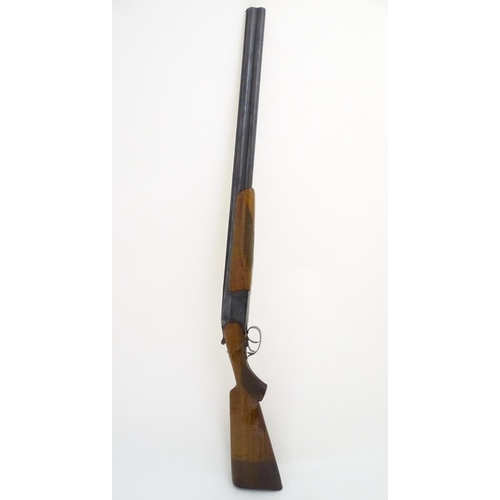 507 - Shotgun: a Baikal 'IJ-27' 12 bore over and under, 28 1/2'' barrels with solid, flat file cut top rib... 