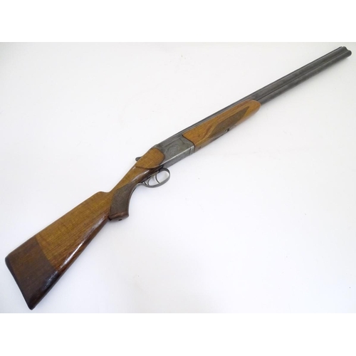 507 - Shotgun: a Baikal 'IJ-27' 12 bore over and under, 28 1/2'' barrels with solid, flat file cut top rib... 