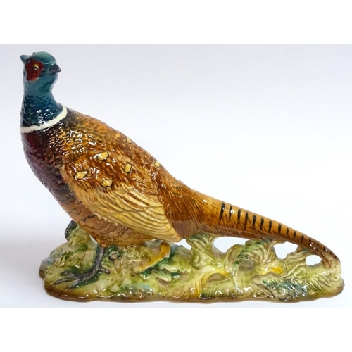 77 - Beswick: a hand painted ceramic pheasant, no 1225, standing 7 1/2'' high.