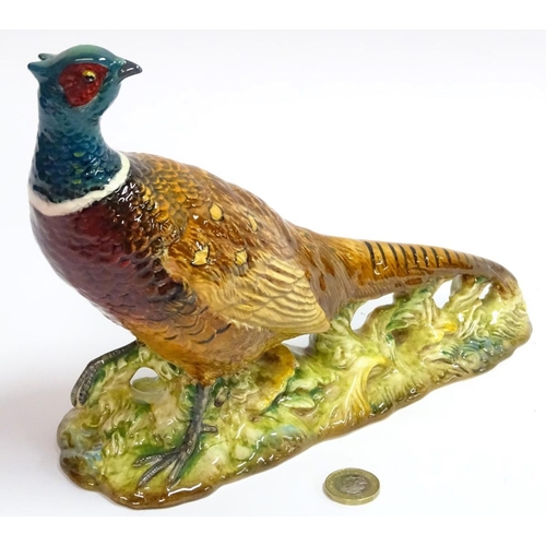 77 - Beswick: a hand painted ceramic pheasant, no 1225, standing 7 1/2'' high.