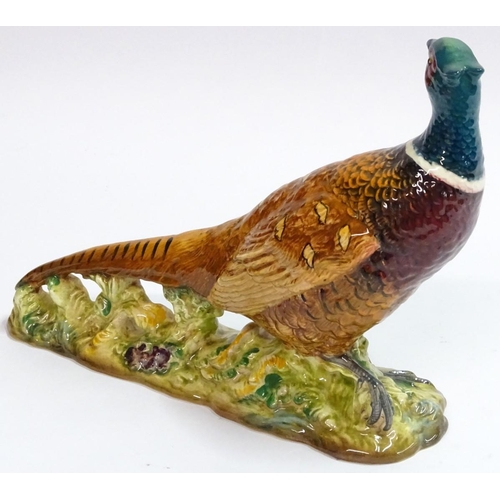 77 - Beswick: a hand painted ceramic pheasant, no 1225, standing 7 1/2'' high.