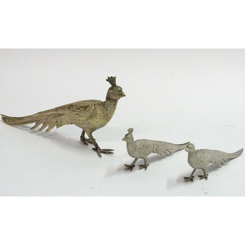 87 - A silverplate peacock place card holder, 8 3/4'' long. Together with a pair of smaller silver plate ... 