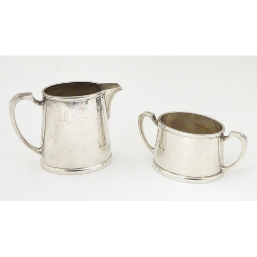 390 - Militaria: a silver plated cream jug and sugar bowl by Mappin & Webb, stamped 'KF.18074' (jug), KF.1... 