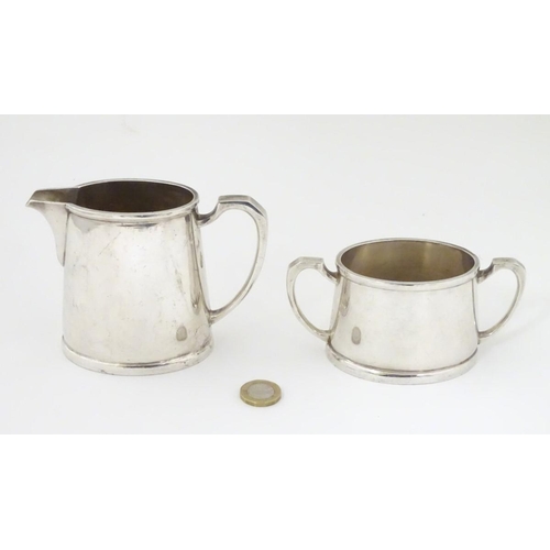 390 - Militaria: a silver plated cream jug and sugar bowl by Mappin & Webb, stamped 'KF.18074' (jug), KF.1... 