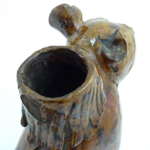 41 - An unusual 19thC Turkish Cannalake Pottery earthenware jug in the form of a cat / lion, the lid form... 