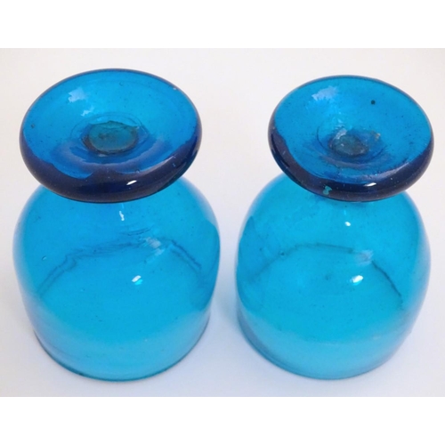 115 - Two 19thC turquoise soda glass pedestal drinking glasses. Approx. 5'' high.