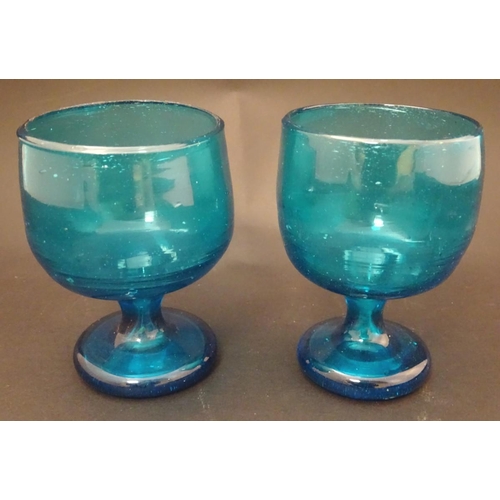 115 - Two 19thC turquoise soda glass pedestal drinking glasses. Approx. 5'' high.