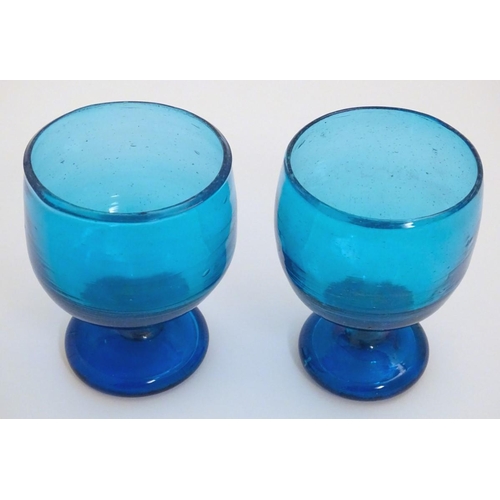 115 - Two 19thC turquoise soda glass pedestal drinking glasses. Approx. 5'' high.