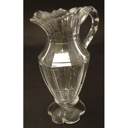 146 - An Irish glass water jug c.1800, together with a 19thC cut glass cream jug. Tallest approx. 9'' high... 