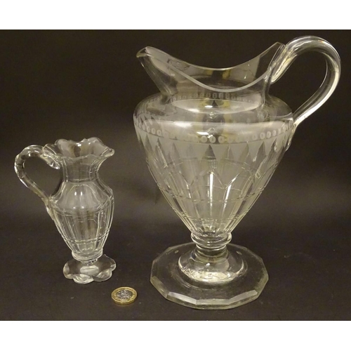 146 - An Irish glass water jug c.1800, together with a 19thC cut glass cream jug. Tallest approx. 9'' high... 
