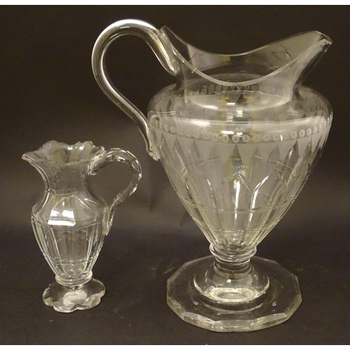 146 - An Irish glass water jug c.1800, together with a 19thC cut glass cream jug. Tallest approx. 9'' high... 