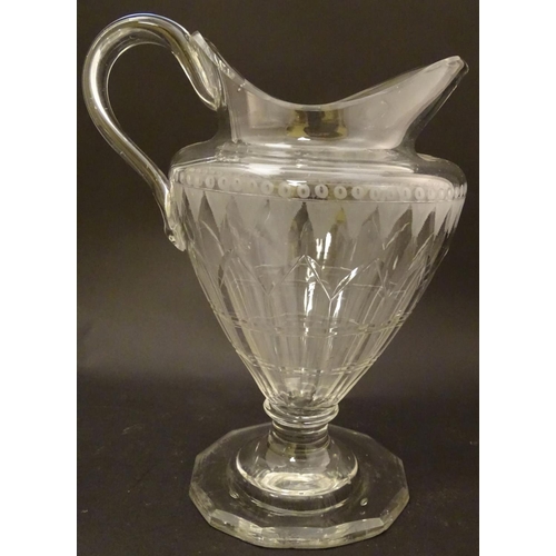 146 - An Irish glass water jug c.1800, together with a 19thC cut glass cream jug. Tallest approx. 9'' high... 