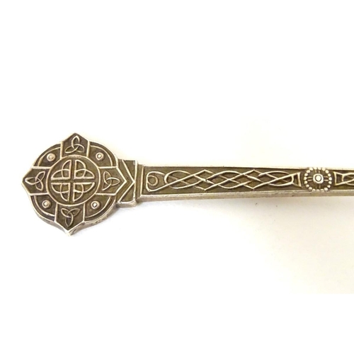 170 - A silver teaspoon with Celtic decoration and engraved M.L.G.C ( possibly Mount Lawley Golf Club ). H... 