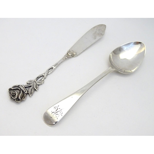 184 - A .800 German silver butter knife with rose decoration to handle together with a teaspoon hallmarked... 