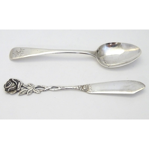 184 - A .800 German silver butter knife with rose decoration to handle together with a teaspoon hallmarked... 