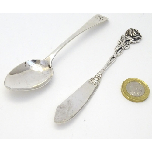 184 - A .800 German silver butter knife with rose decoration to handle together with a teaspoon hallmarked... 