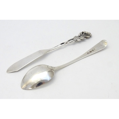 184 - A .800 German silver butter knife with rose decoration to handle together with a teaspoon hallmarked... 