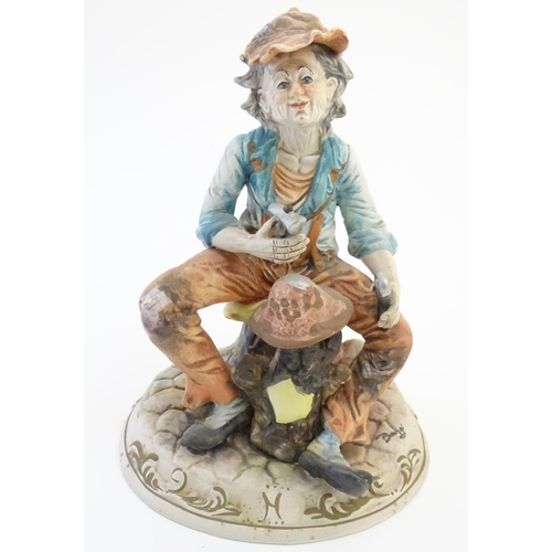 63 - A Capodimonte figure of an elderly man with tools, possibly an armourer. Indistinctly signed to base... 