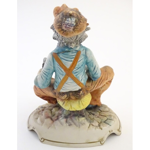63 - A Capodimonte figure of an elderly man with tools, possibly an armourer. Indistinctly signed to base... 