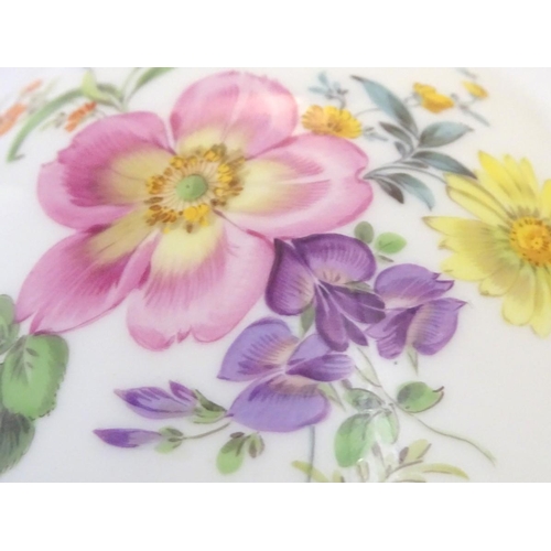 72 - A Continental lidded vase with hand painted floral decoration. Meissen style marks under. Approx. 9 ... 