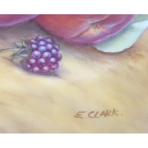 77 - A Royal Worcester plate with hand painted decoration depicting a study of a still life of fruit, app... 