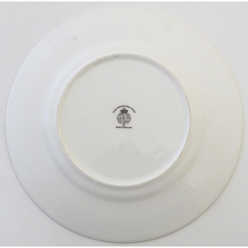 77 - A Royal Worcester plate with hand painted decoration depicting a study of a still life of fruit, app... 