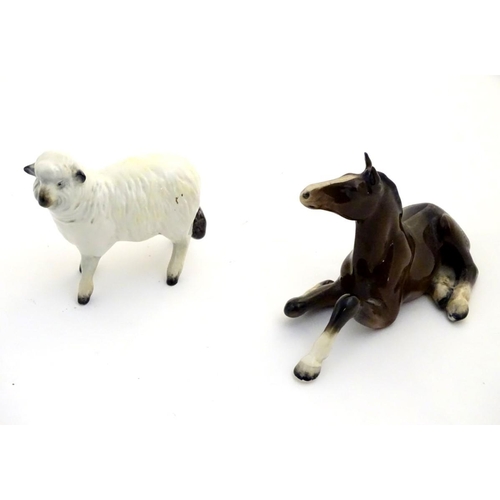 78 - A Beswick model of a sheep, model no. 935, together with a Beswick model of a recumbent shire foal, ... 