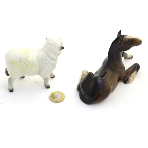 78 - A Beswick model of a sheep, model no. 935, together with a Beswick model of a recumbent shire foal, ... 