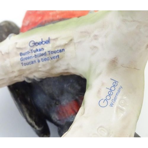 81 - A W. Goebel model of a green billed toucan bird perched on a branch. Signature and model number impr... 